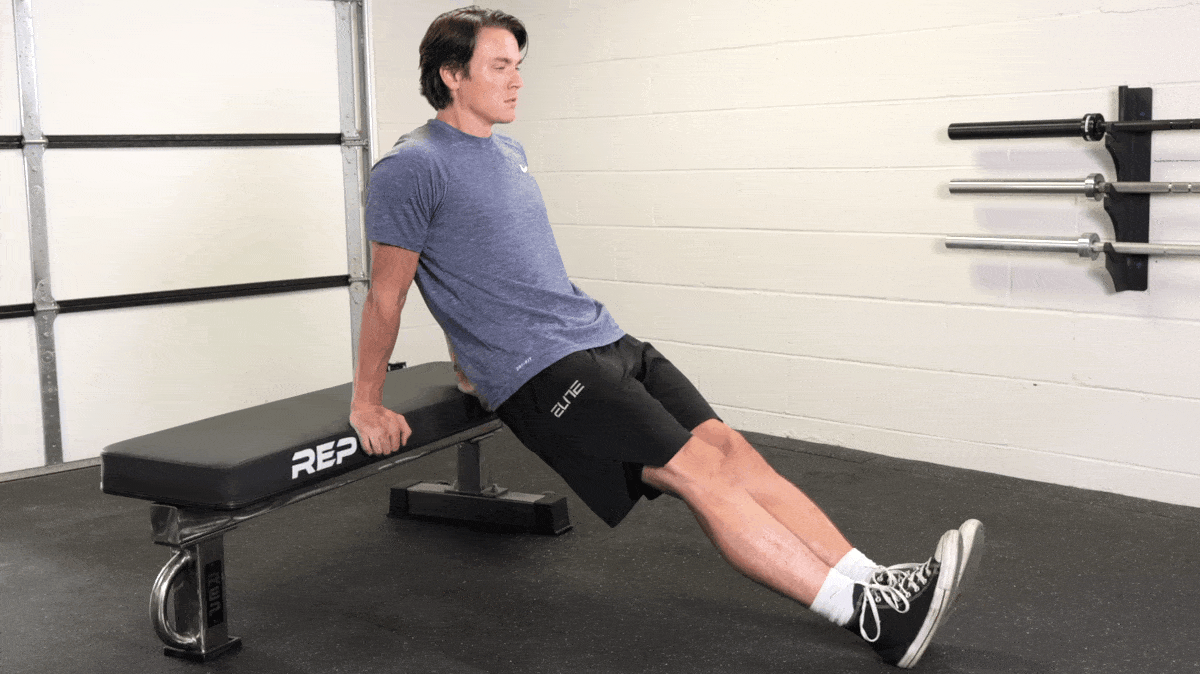 Jake performing the triceps dip with a weight bench. 